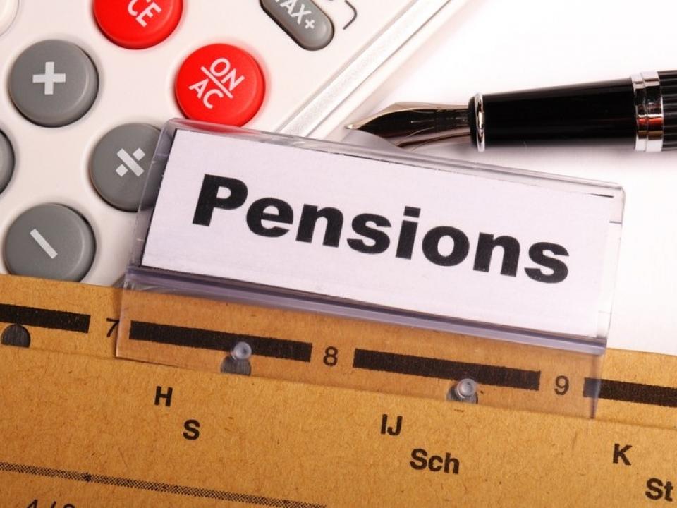 The word pensions is displayed on the screen beside a pen and a calculator