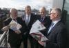 Martin O'Halloran, Chief Executive Officer of the HSA, Pat Breen, TD, Minister of State at the Department of Business, Enterprise and Innovation, Tom Coughlan, Chairperson of the HSA, and ESRI Director Alan Barrett engage in discussion.