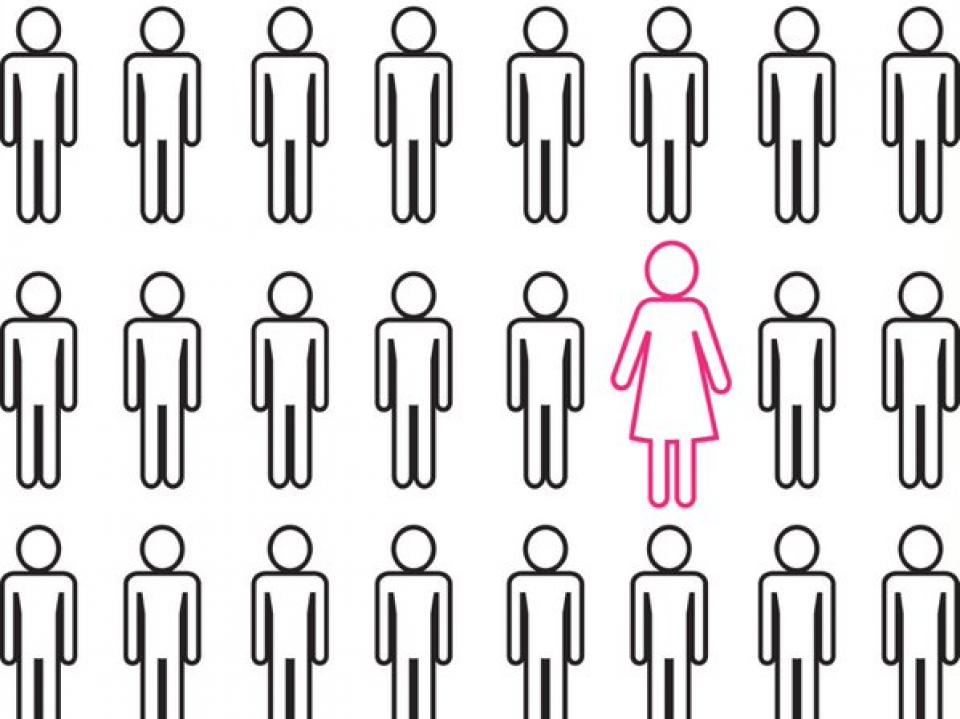 Image of one woman among a group of men