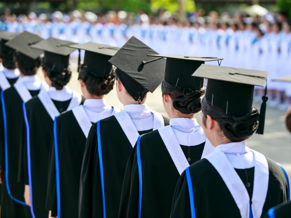 Line of graduates in caps and gowns