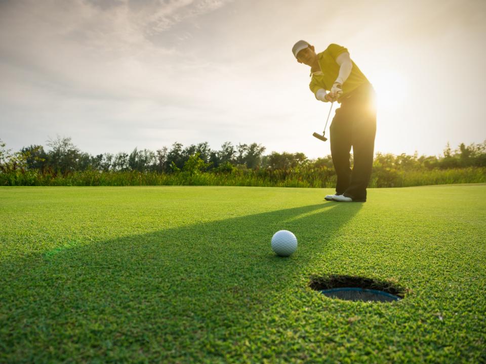 Man playing golf