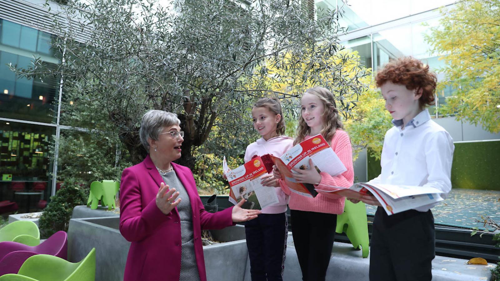 Minister Zappone with three children at the launch of the Key Findings