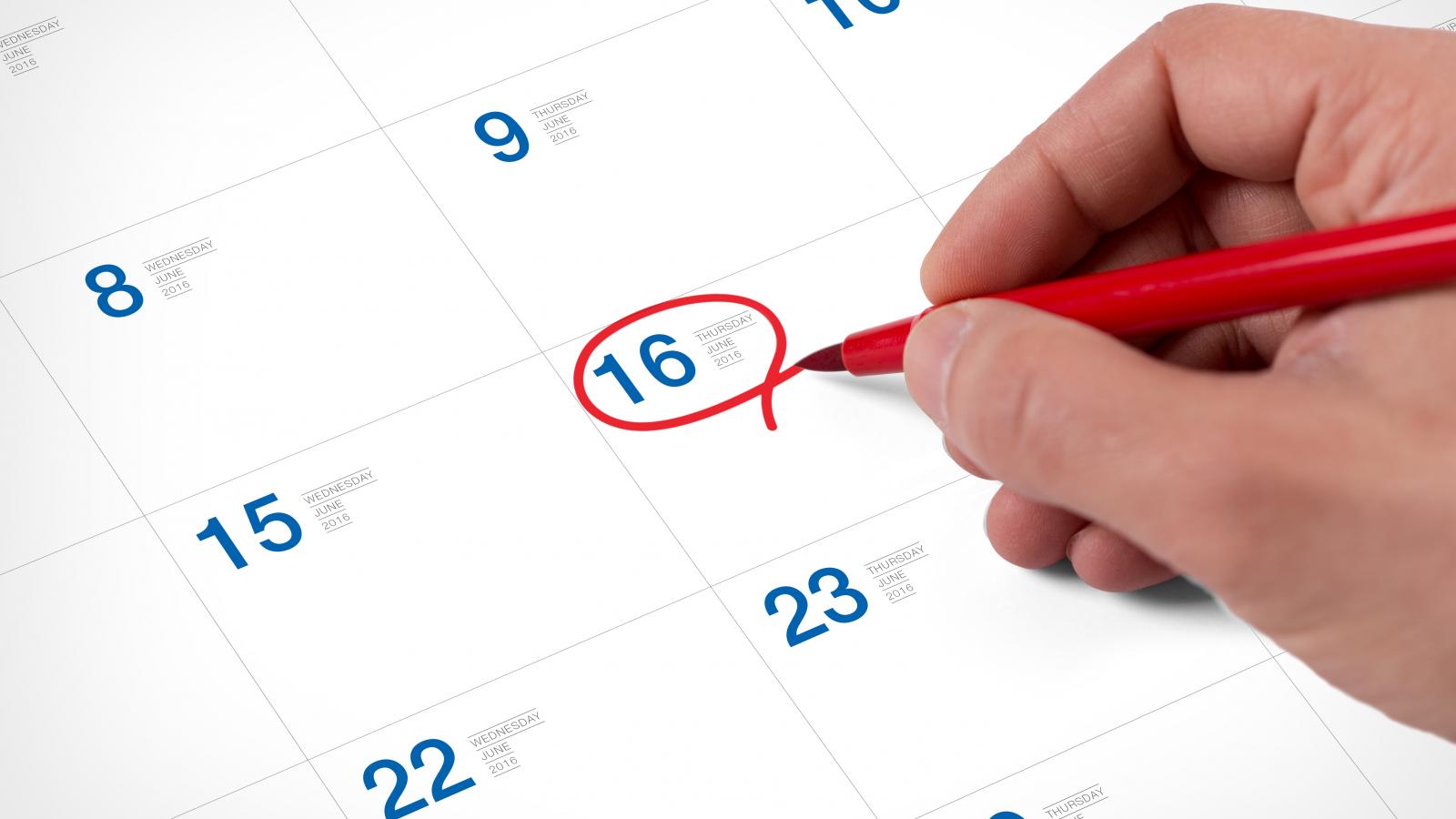 Person circling a date in a calendar