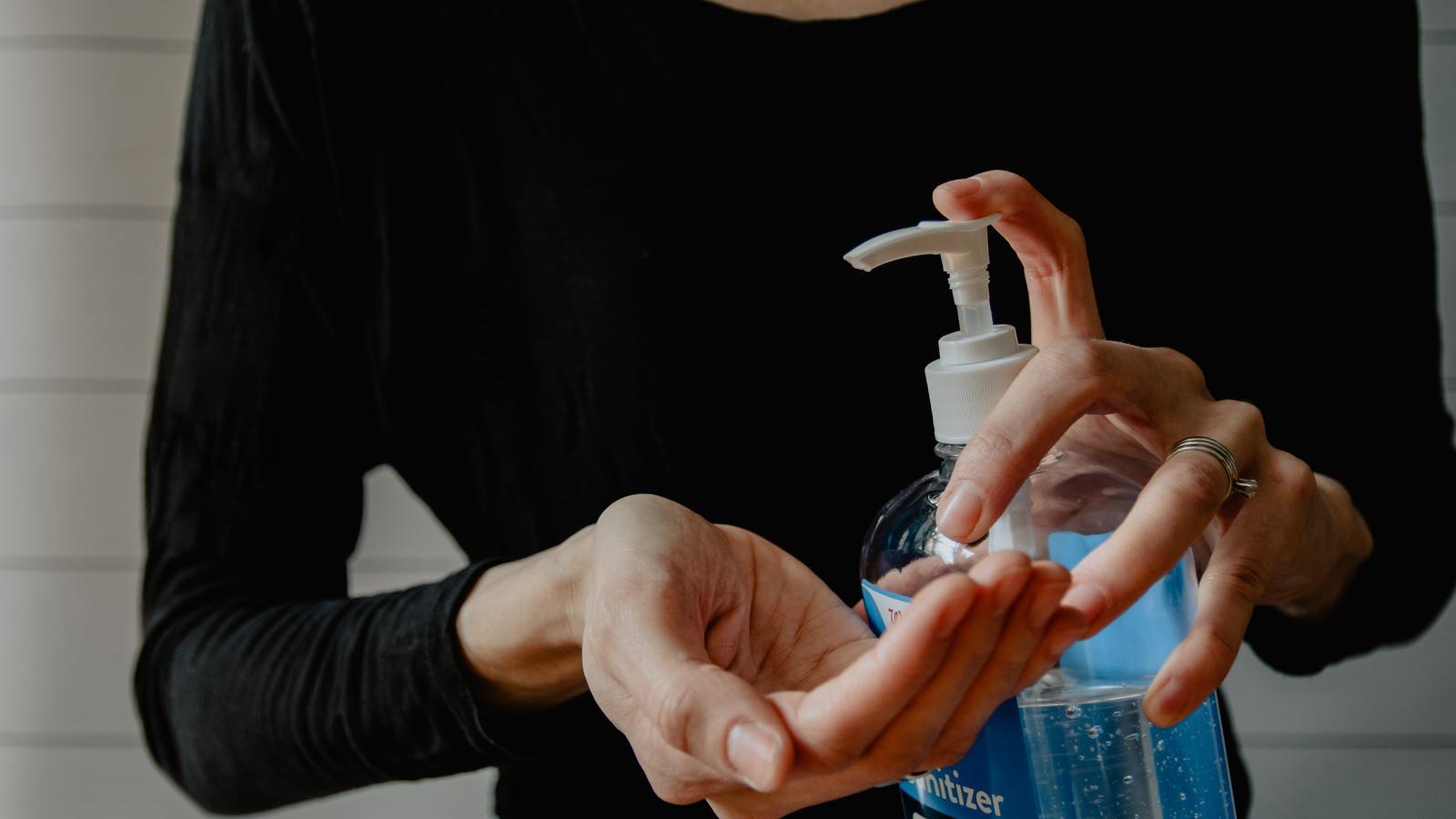 Person using hand sanitisier