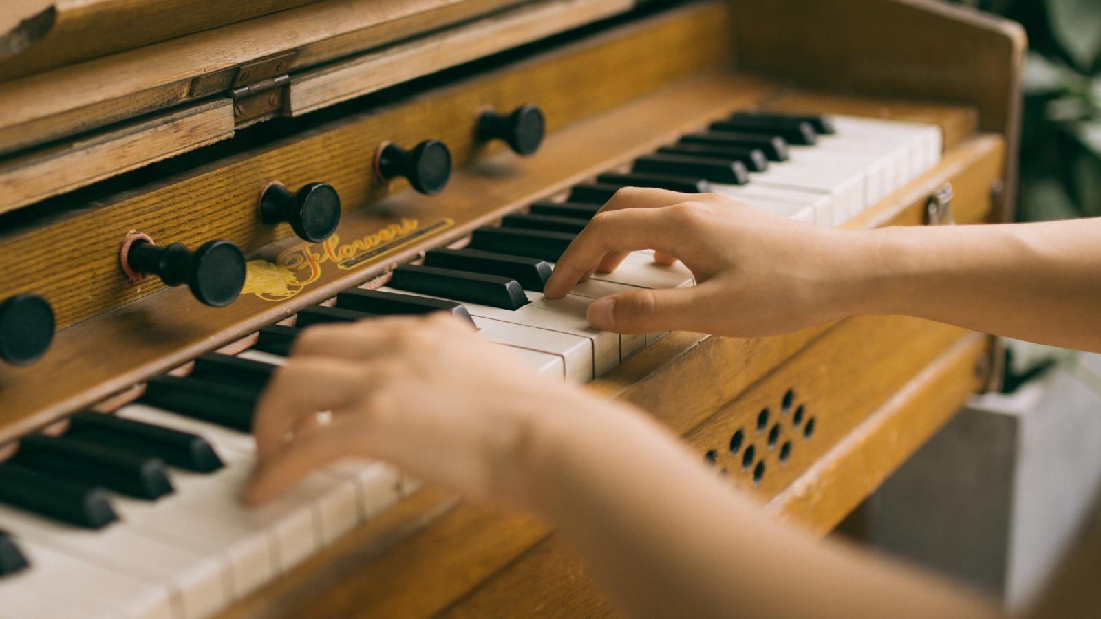 Child playing a piano