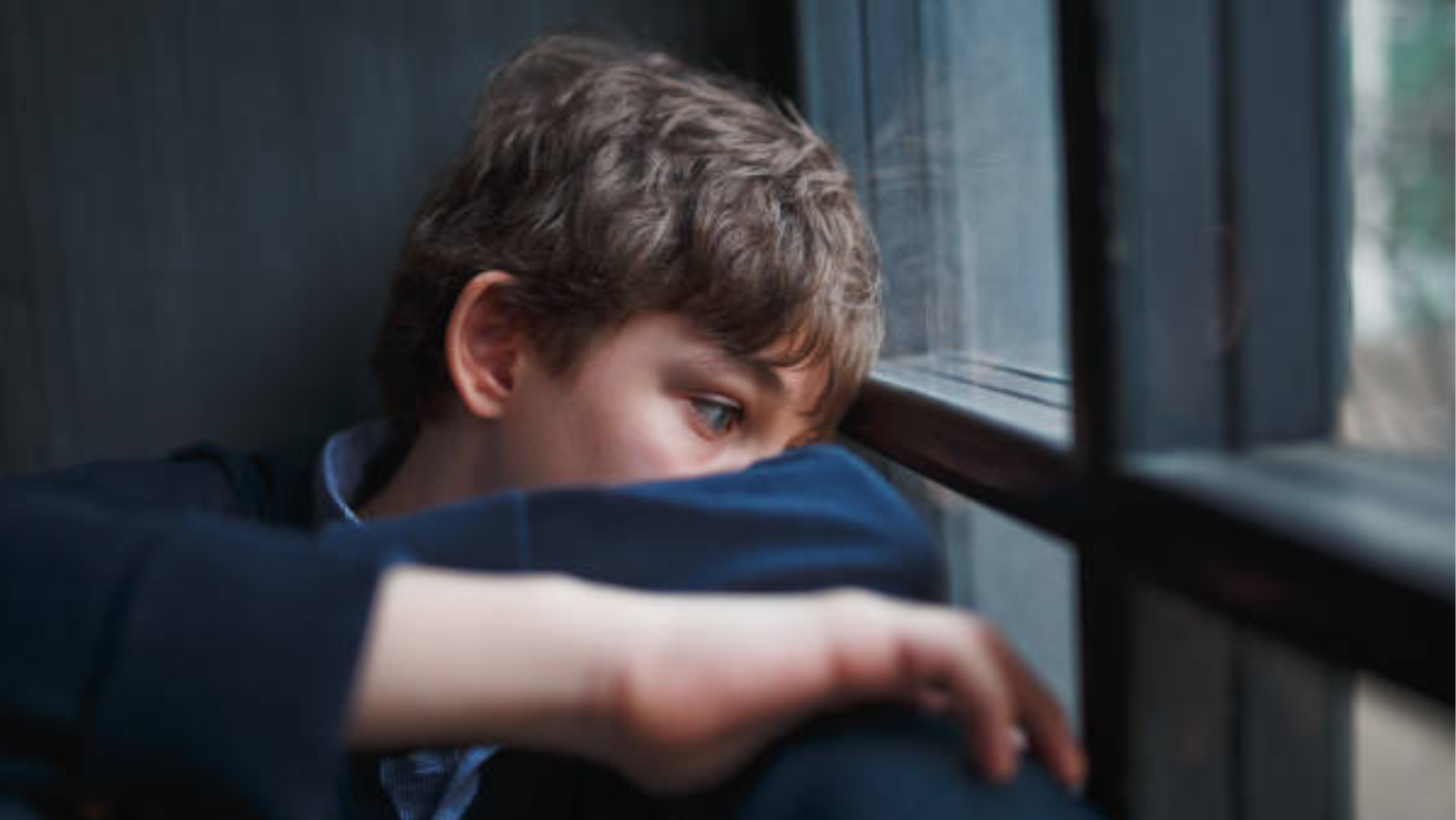 boy looking out the window