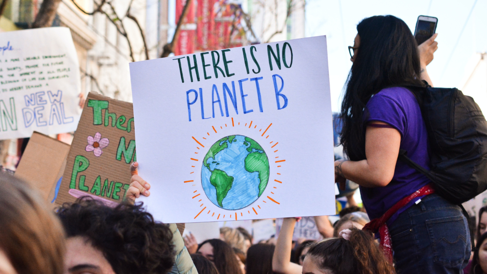 climate protesters, with a sign saying 'there is no planet B'