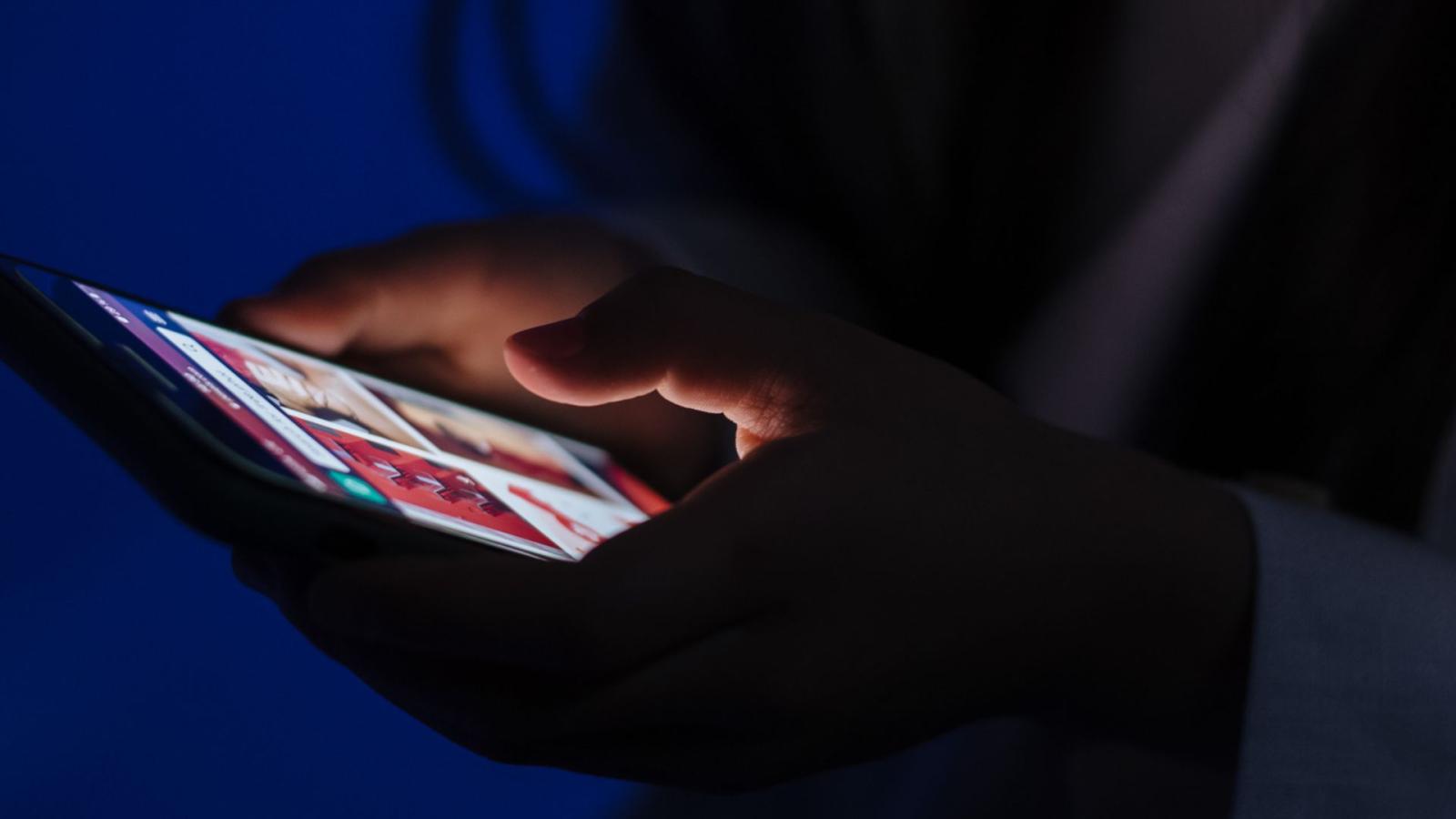 Hands of someone on a phone 